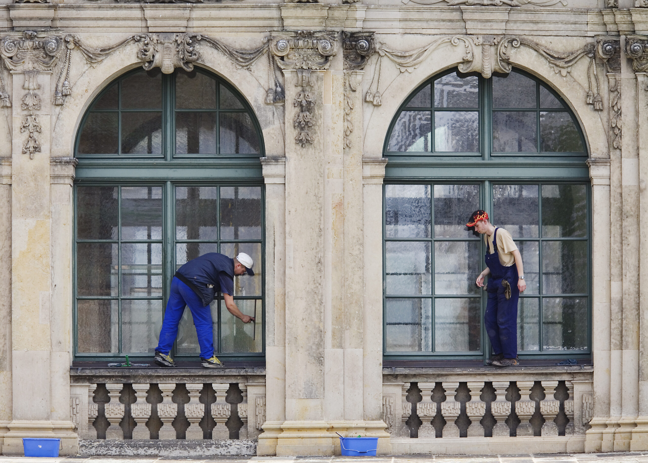 Window cleaners in Dresdner Zwinger Museum. Dresden, Germany